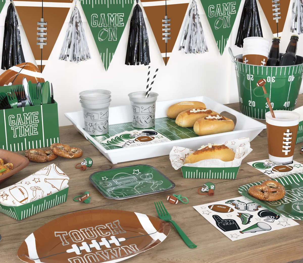 Football party table with game day plates, cups and pennant banner